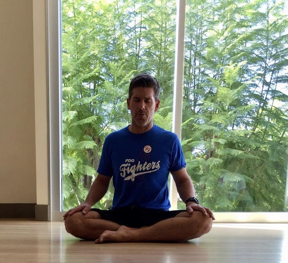 man meditating sitting down